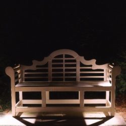 Cross lighting effect on a garden bench